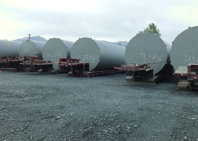 six oil tanks lined up