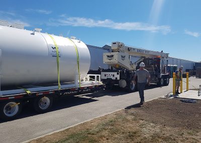 oil tank strapped to trailer being transported