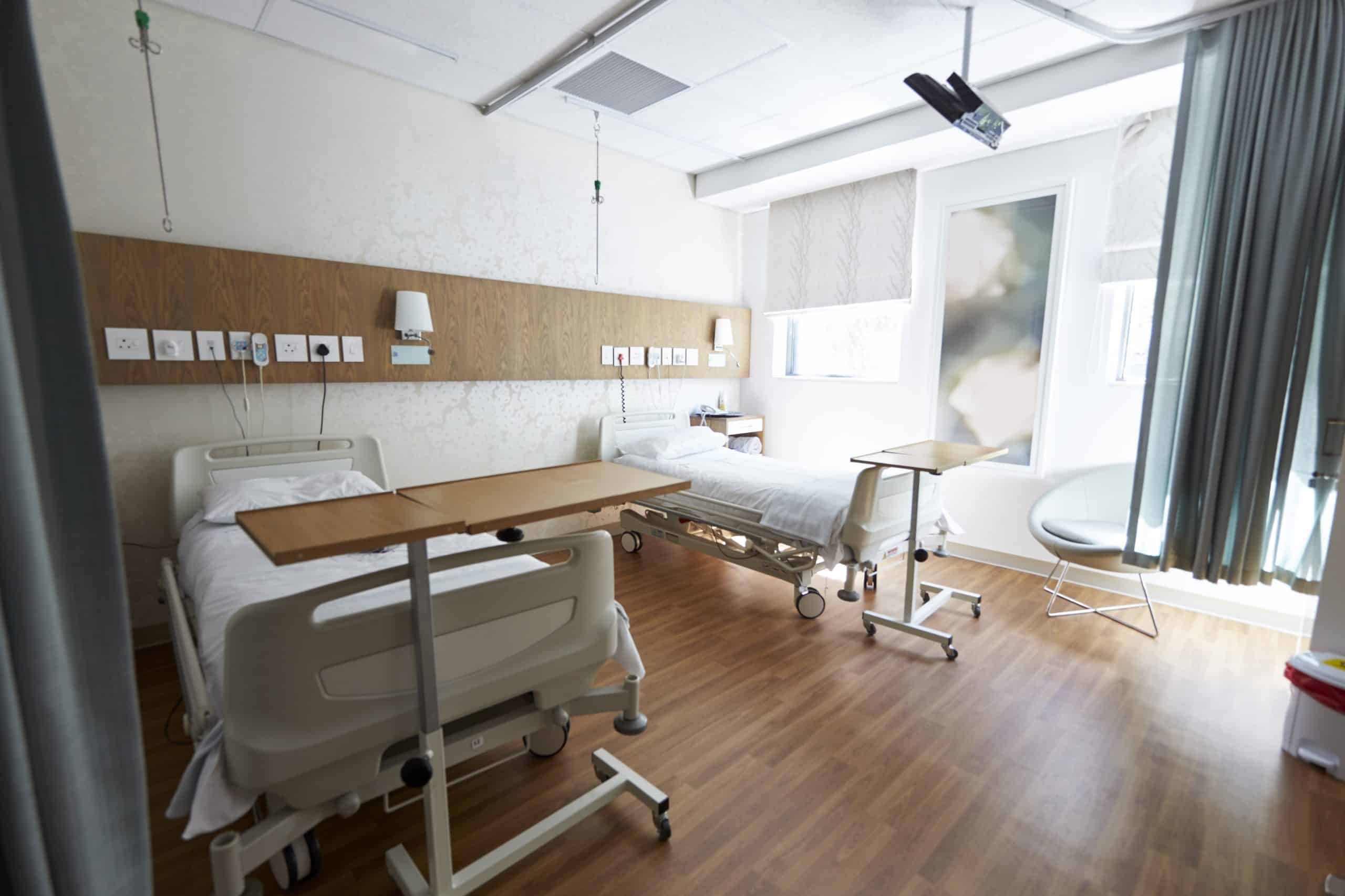 hospital institution with two clean white beds