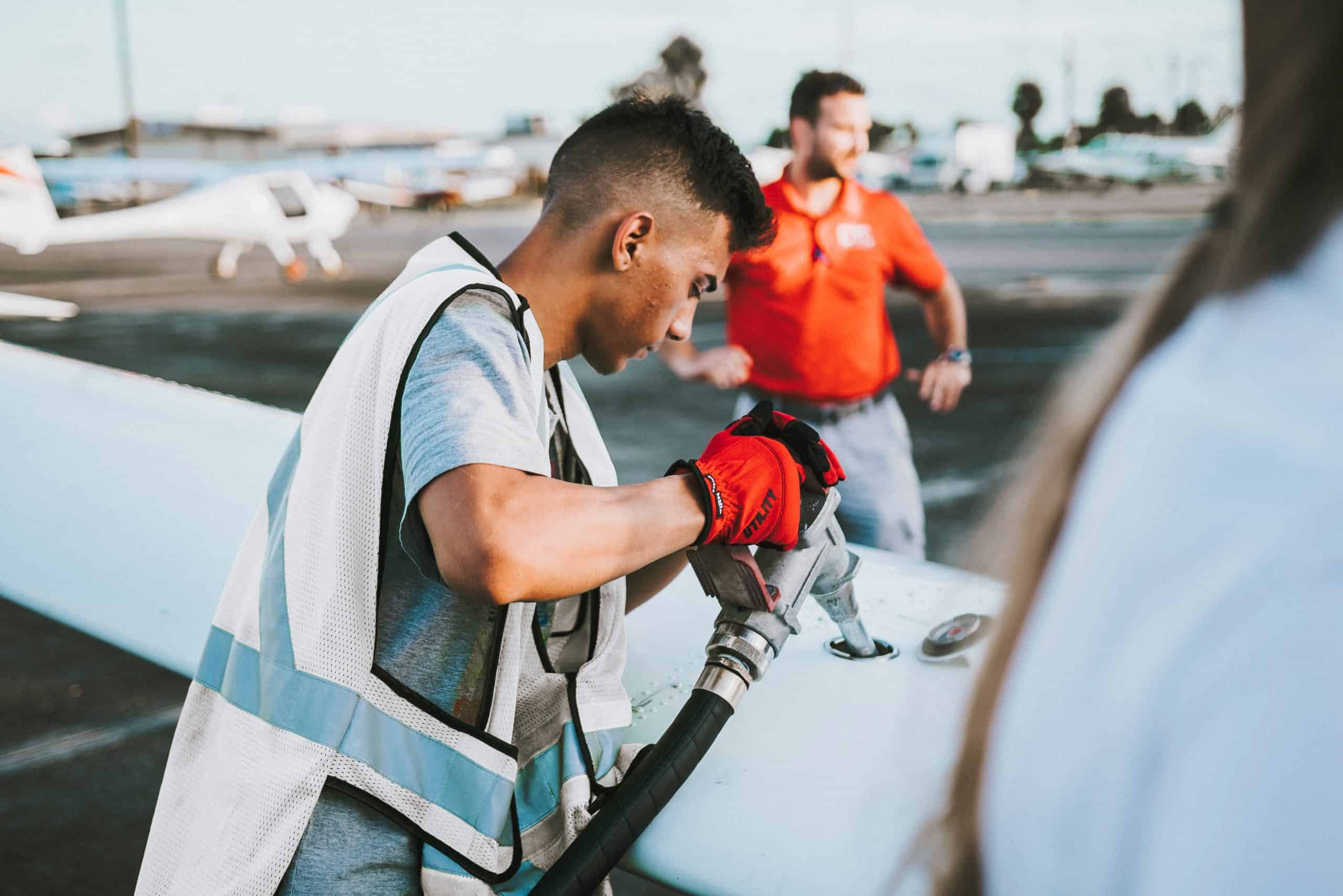 aviation fueler refuelling an airplane