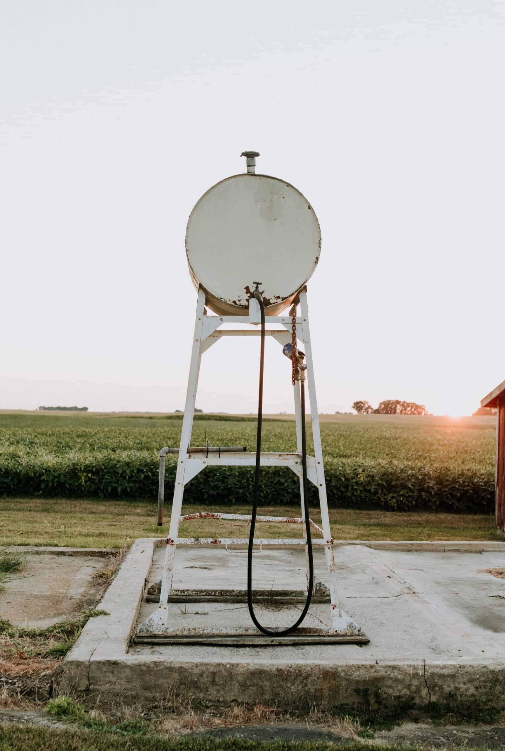 small storage tank containter with a host amongst tall grass